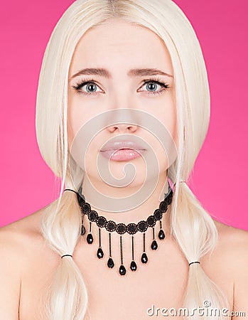 Portrait of a young woman with a pitiful look. Long white hair and makeup Stock Photo