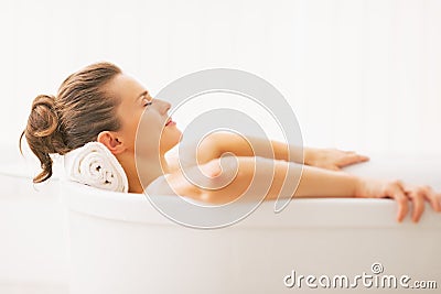 Portrait of young woman relaxing in bathtub Stock Photo