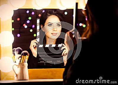 Portrait of young woman with slapstick Stock Photo