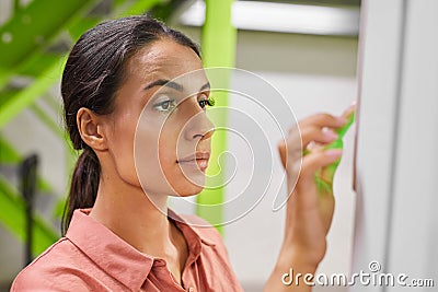 Woman Using Control Panel in Self Storage Unit Stock Photo