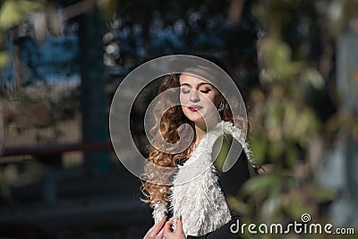 Portrait of a young woman wear sleeveless sheep coat Stock Photo