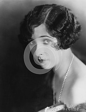 Portrait of young woman wearing pearl necklace Stock Photo