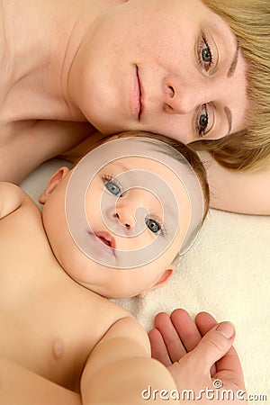 Portrait of the young woman with the baby on a light background Stock Photo