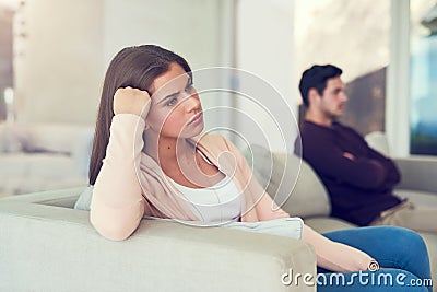 Becoming disconnected. Portrait of a young woman giving her husband the silent treatment after a fight. Stock Photo