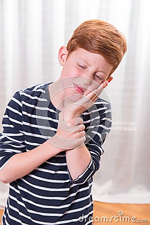 Portriat small boy having tooth ache Stock Photo