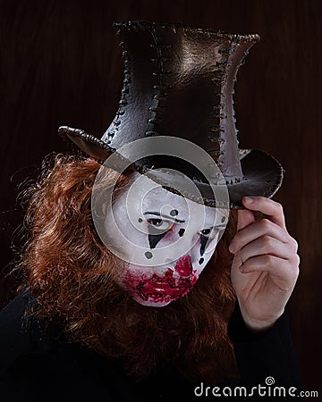 Portriat of a Young woman ins scary clown make up. Stock Photo