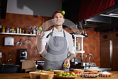 Chef Juggling Citrus Stock Photo