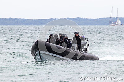 British police patrolling in a rigid inflatable boat Editorial Stock Photo