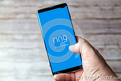 02-05-2021 Portsmouth, Hampshire, UK A Mobile phone or cell phone being held showing the Ring doorbell app open on screen Editorial Stock Photo