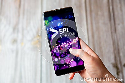 03-22-2021 Portsmouth, Hampshire, UK A mobile phone or cell phone being held in a hand with the SPI Cinemas app open on screen Editorial Stock Photo