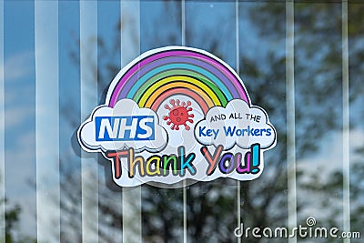 04/24/2020 Portsmouth, Hampshire, UK A rainbow in a houses window to thank the NHS and key workers during the Coronavirus or Covid Editorial Stock Photo