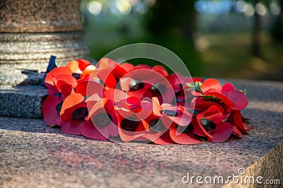 08/09/2020 Portsmouth, Hampshire, UK A red poppy wreath laid on a war memorial in remembrance of war dead Editorial Stock Photo