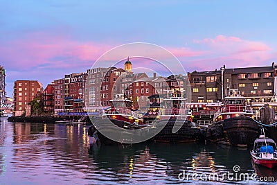 Portsmouth waterfront under colourful sky at dusk Stock Photo