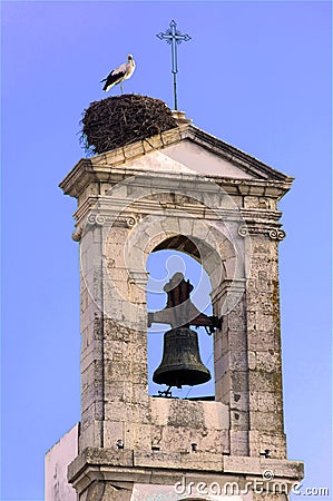 Portugal, Algarve, Faro: Stork on the bell tower Stock Photo