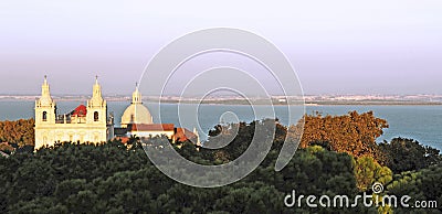 Portugal, Lisbon: Church and Taje River at dusk Stock Photo