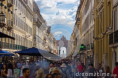 Portugal, Lisbon - 25/10/2018: rua Augusta street with arch and crowd of tourists. Famous shopping street in Lisboa. Editorial Stock Photo