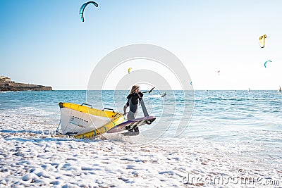 Portugal, Sintra, August 2022 Praia da Guincho Foil surfer going hydrofoil surfing in the sea on a bright sunny day Editorial Stock Photo