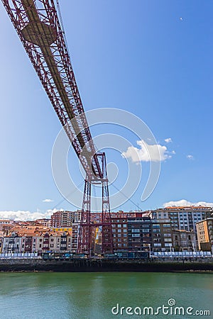 Biscay bridge flying with gondola over river Nervion. Portugalete landmark. Famous bridge called Puente de Vizcaya near Bilbao. Editorial Stock Photo