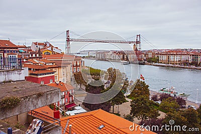 Biscay bridge flying with gondola over river Nervion. Portugalete landmark. Famous bridge called Puente de Vizcaya near Bilbao. Editorial Stock Photo