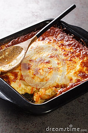 Portuguese Bacalhau Espiritual or Spiritual Cod baked in a bechamel sauce with onions and carrots and melted and crispy cheese Stock Photo