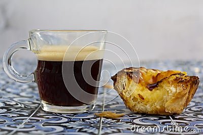 Portuguese custard tart called psatel de nata and espresso coffee Stock Photo