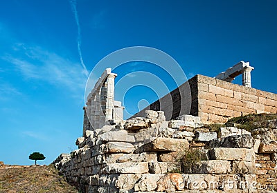 Poseidon temple in Sounio Greece and a lonely tree Stock Photo