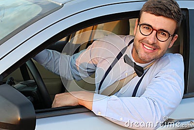 Posh driver wearing elegant outfit Stock Photo