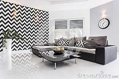 Posh living room with white tiled floor Stock Photo