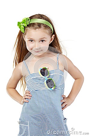 Posing little girl in striped blue sundress Stock Photo