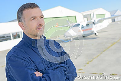 Posing outside a hangar Stock Photo