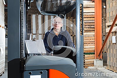 Posing reach truck driver Stock Photo