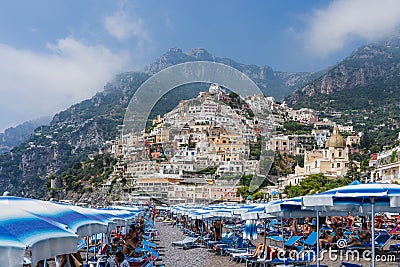 Positano, Italy - August 12, 2019: People enjoy summer beach time at Positano in Amalfi Coast Editorial Stock Photo