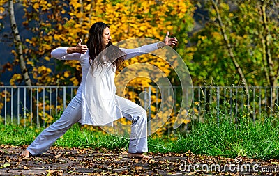 Positions of arms and hands of yoga practiced in the park Stock Photo