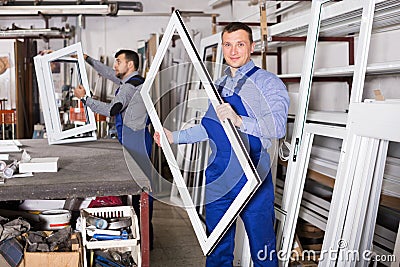 Workman showing PVC manufacturing output Stock Photo