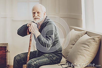 Positive aged man resting at home Stock Photo