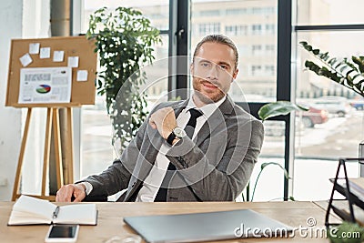 positive ambitious businessman in grey suit Stock Photo