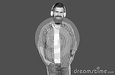 positive bearded hipster listen to music in headphones Stock Photo