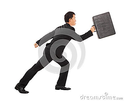 Positive businessman running and holding briefcase Stock Photo