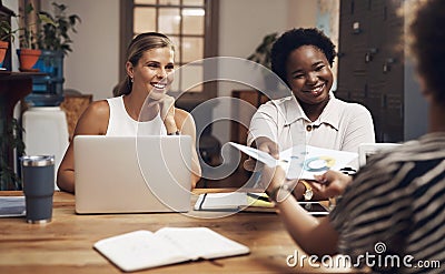 Positive changes come from a collaborative work culture. a group of young businesswomen having a meeting in a modern Stock Photo