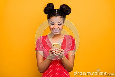 Positive cheerful afro american girl addicted blogger use smart phone chatting texting sms repost social network Stock Photo