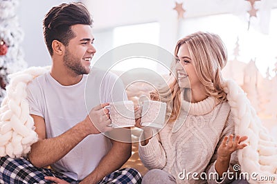 Positive cheerful couple having tea Stock Photo