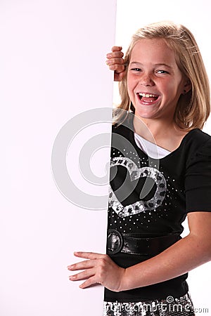 Positive Cheerful Happy 10 year Old Girl With Sign Stock Photo