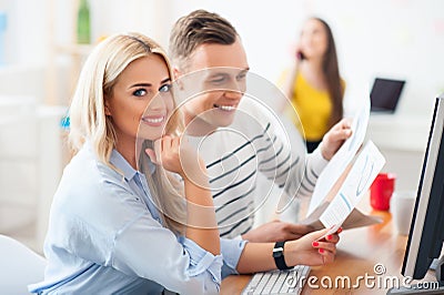 Positive colleagues working with papers Stock Photo