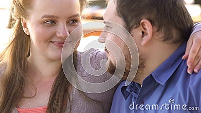 Positive couple of beloved embracing, happy overweight family, soulmates closeup Stock Photo