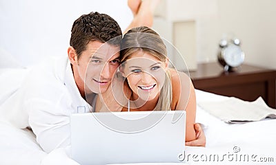 Positive couple surfing on the internet Stock Photo