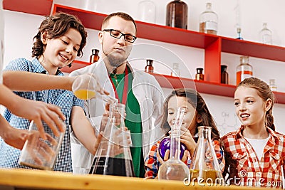 Positive delighted children attending a scientific club Stock Photo