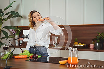 Positive delighted girl standing at the table Stock Photo