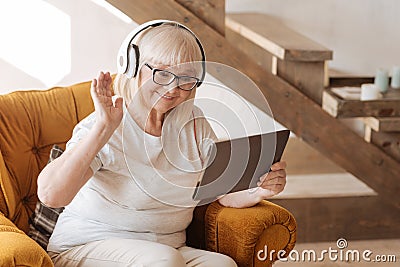 Positive delighted woman listening to music Stock Photo