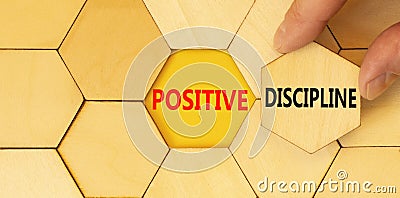 Positive discipline symbol. Concept words Positive discipline on beautiful wooden puzzles. Beautiful yellow paper background. Stock Photo