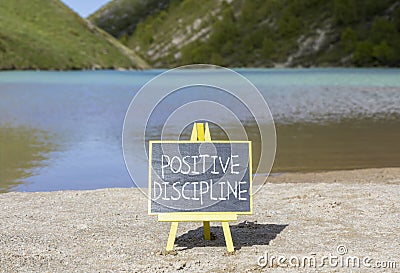 Positive discipline symbol. Concept words Positive discipline on black chalk blackboard. Chalkboard. Beautiful mountain lake Stock Photo
